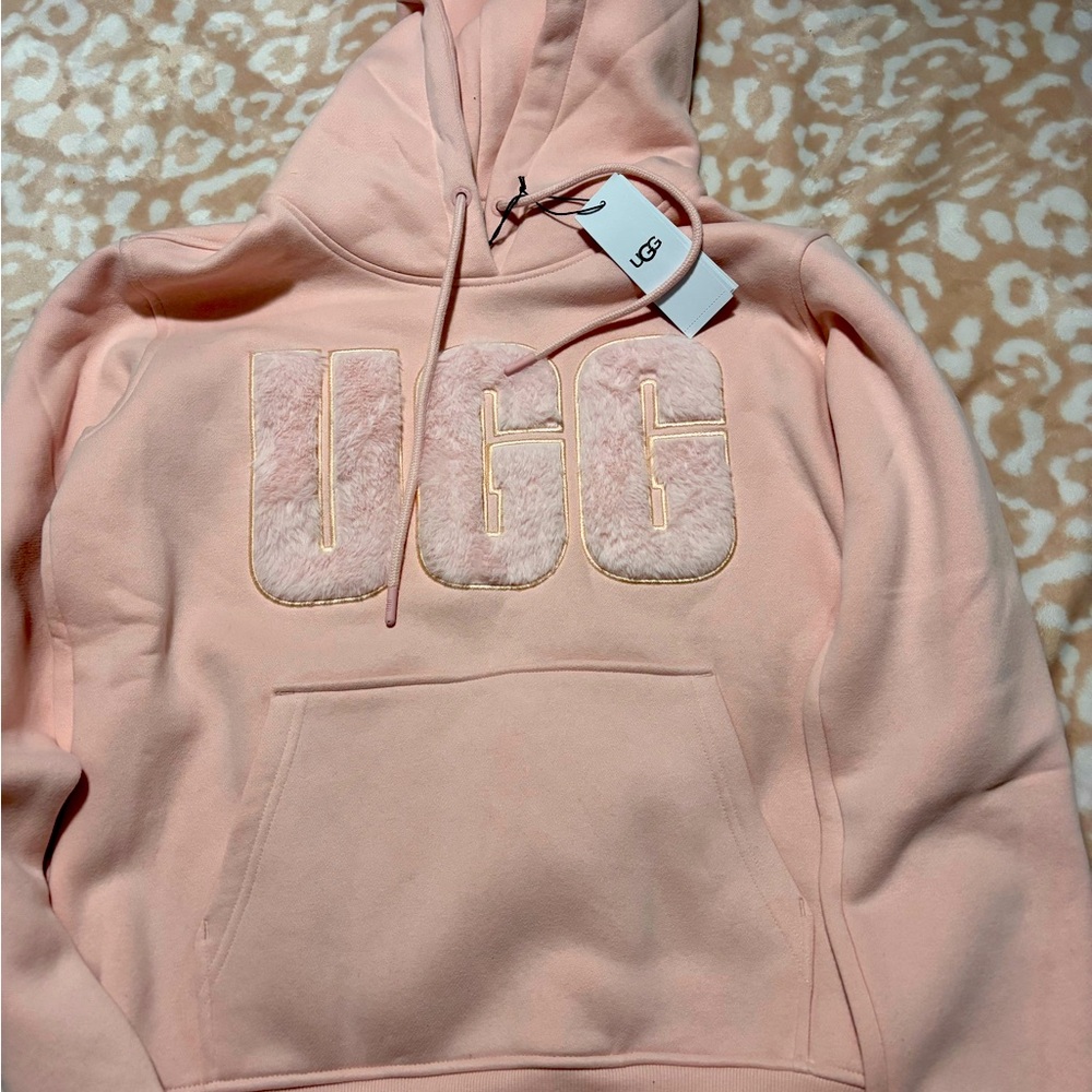 Pink woman’s UGG hoodie